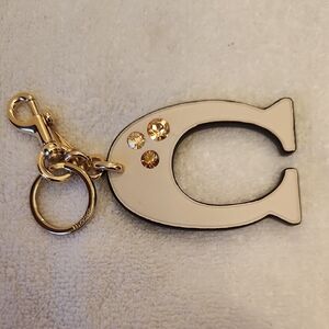 Coach Cream and Gold Fish Keychain